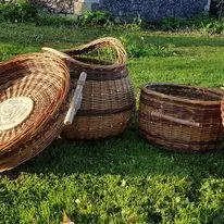 Set of willow baskets arranged outdoors on grass