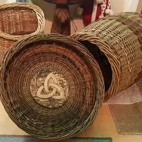 Large round willow basket or tray shown close-up
