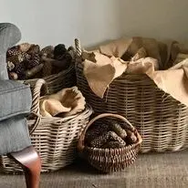 Workshop scene with willow baskets and materials on a table
